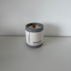 Origin Forest Walk candle with its Koze label, jesmonite pot and natural soy wax, in anthracite grey