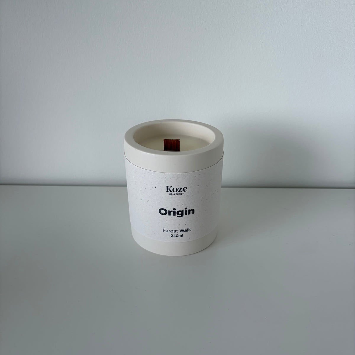Origin Forest Walk candle in an off-white jesmonite pot, handmade in Switzerland.